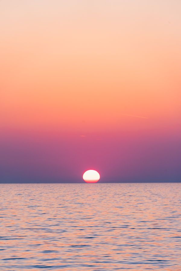Beautiful Sunset Above the Sea with Golden & Violet Sky Free Photo