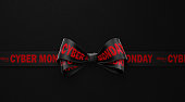 Happy Cyber Monday Written Black Ribbon over Black Background