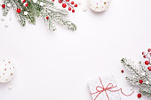 Elegant Christmas frame of decorations, fir on white background, copy space.