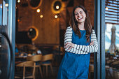 Smiling Female Barista in Coffee Shop