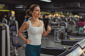 Cardio Workout: Woman Running on Gym Treadmill for a Healthy Heart