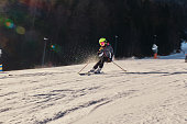 Young girl is skiing down the hill