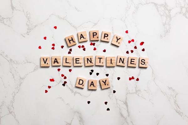 Valentine’s Day Flat Lay Scrabble Letters on White Marble Free Photo