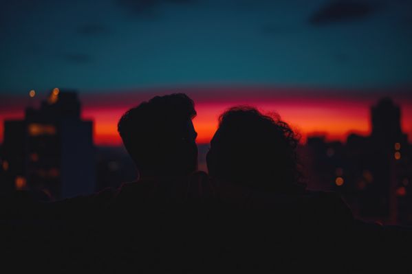 Young Couple Enjoying City View After Sunset Free Image